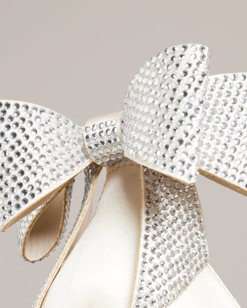 HEMARY-Sandals-We've made the perfect party shoe with HEMARY. With a stiletto heel and crystal embellished bow at the back, these satin sandals are as elegant as they are daring. Slip into the slim open toe strap and secure the buckle ankle fastening, and you're ready to dance the night away. Heeled sandals Satin finish Crystal bow embellishment Open toe Slim toe strap Stiletto heel with golden detail Buckle ankle strap- Ted Baker Romania